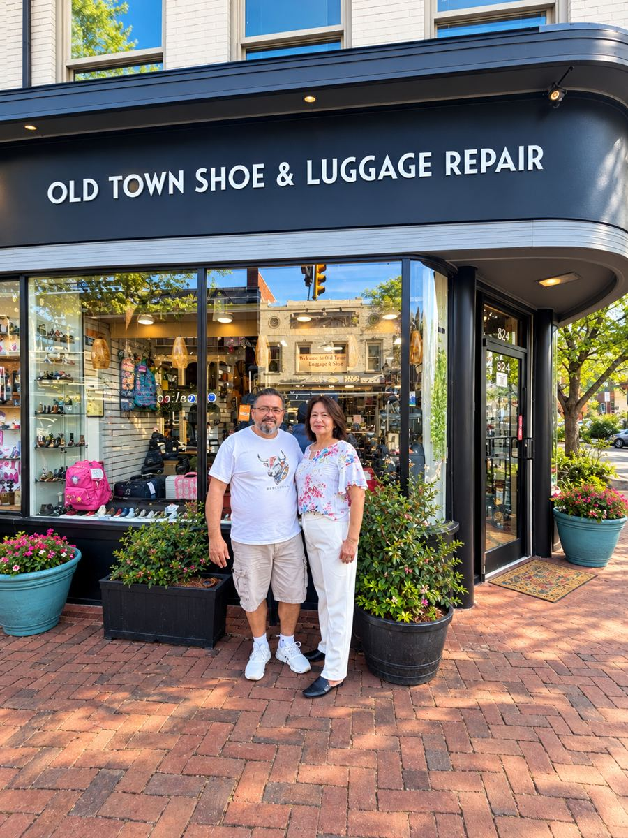 Rodrigo and Jenny Restrepo standing in front of Old Town Shoe & Luggage Repair on King Street